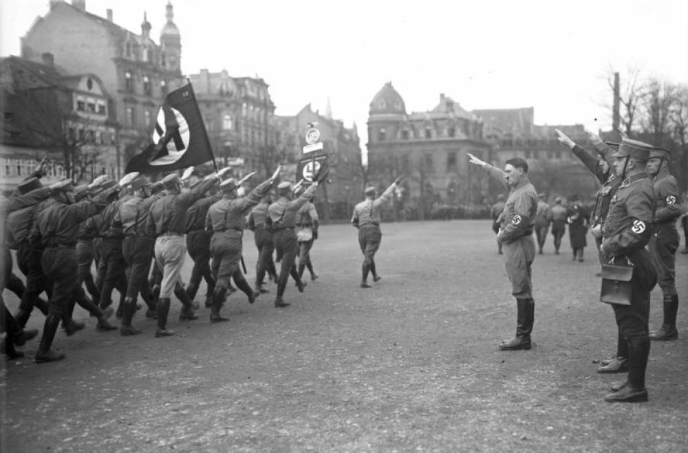 Adolf Hitler before a group of Nazi paramilitary marching in Berlin in 1931