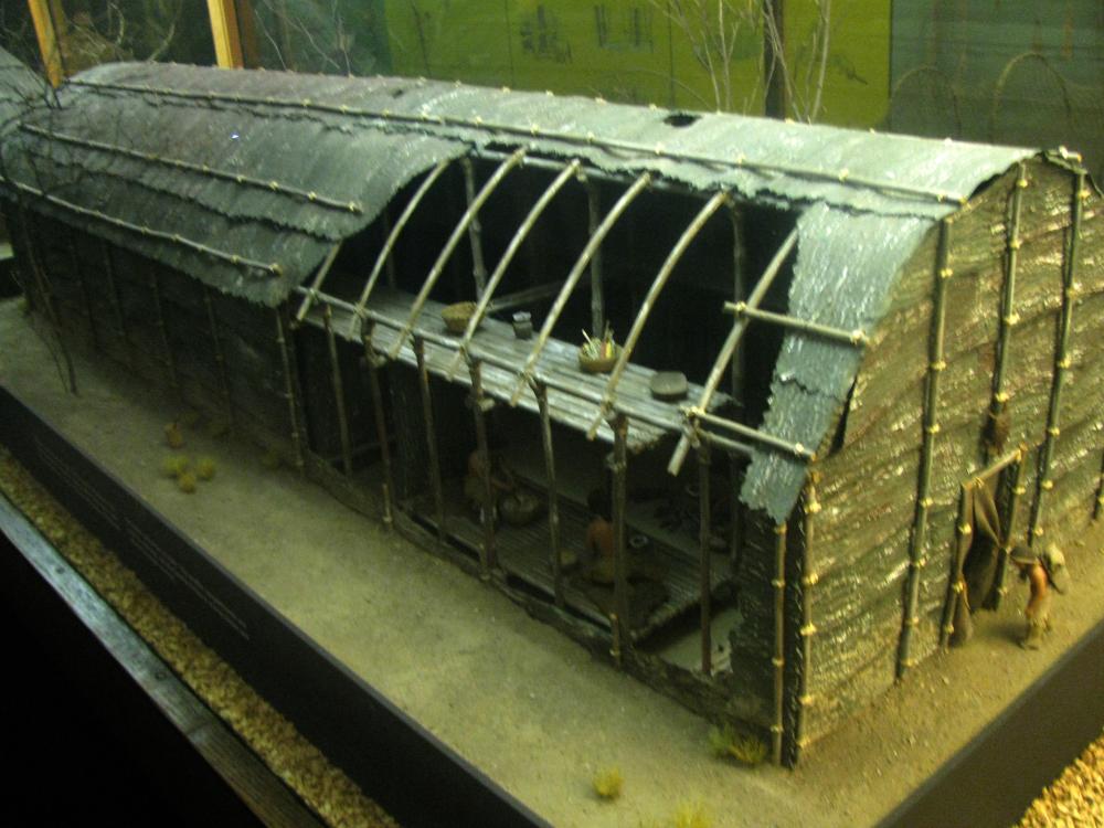 Partially cut-away view of a model showing external appearance and construction of traditional Iroquois longhouse.