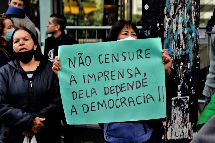 Woman holding a sign with the text of "Don't censor the press, democracy depends on it!!" at the demonstration for the auditable printed vote on Paulista avenue in São Paulo, Brazil