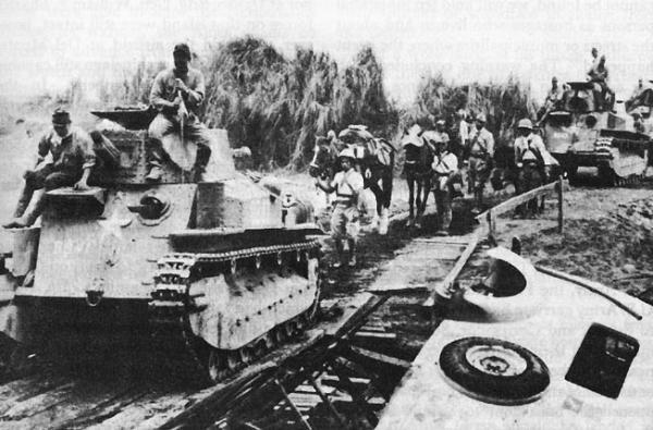 Japanese light tanks moving toward Manila on the day the city was entered